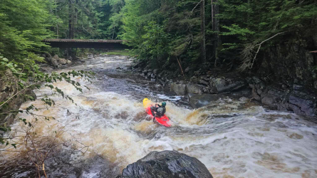 Kayaker descends a drop on the Moose River above Victory Bog Vermont Whitewater Kayaking - photo credit N Lesch-Huie