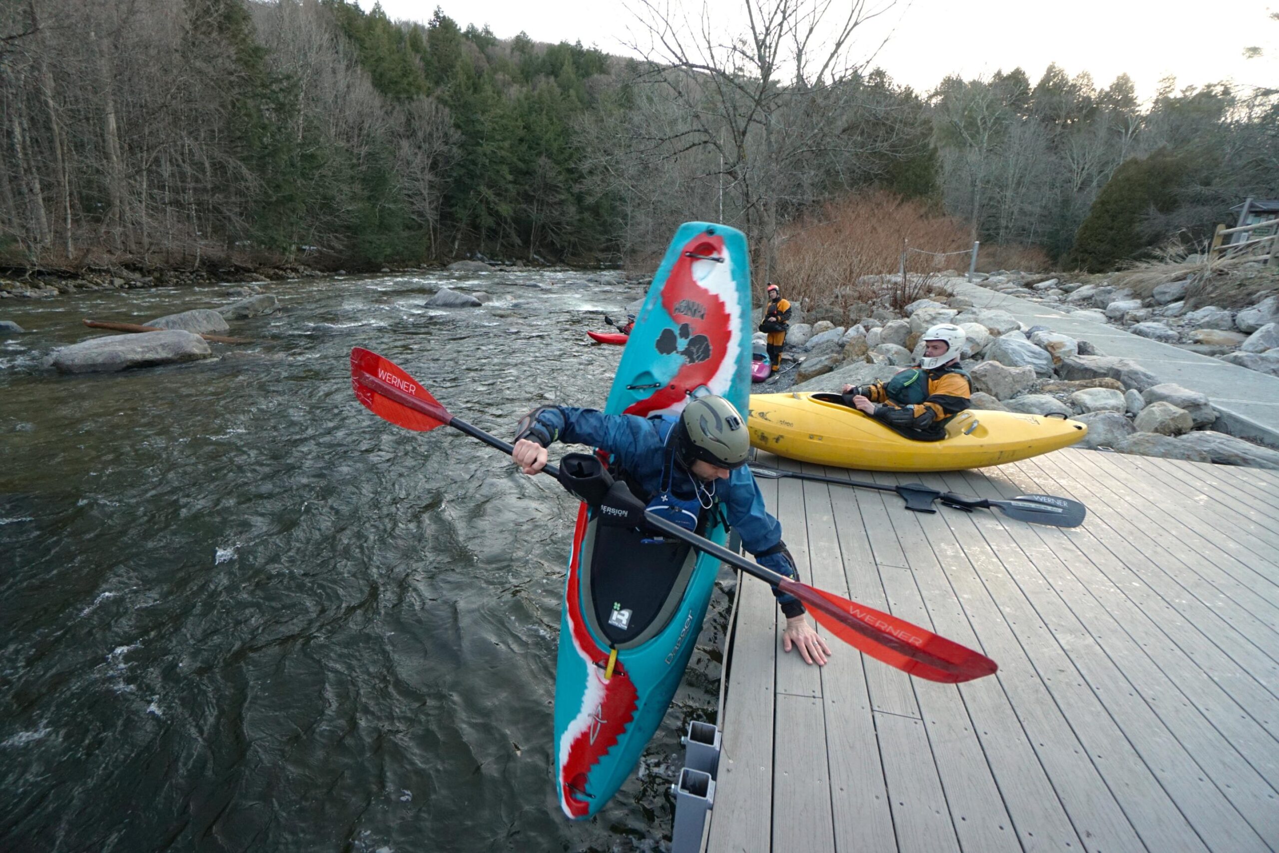 Jordan Vickers free-wheel launches off the fishing platform on the New Haven River in Bristol Vermont